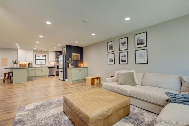 5132 S Atlanta Ave, Tulsa, OK 74105 - living room featuring light wood-type flooring, recessed lighting, and baseboards