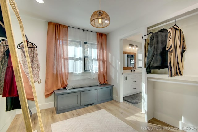 5132 S Atlanta Ave, Tulsa, OK 74105 - mudroom with light wood-style flooring, healthy amount of natural light, a sink, and baseboards