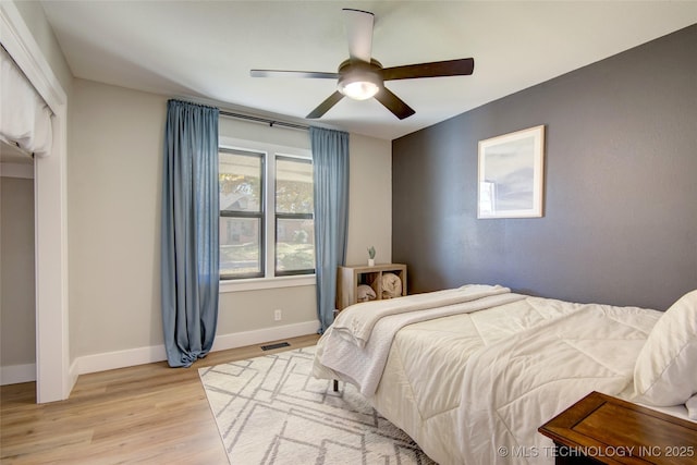 5132 S Atlanta Ave, Tulsa, OK 74105 - bedroom with light wood-style flooring, baseboards, and ceiling fan