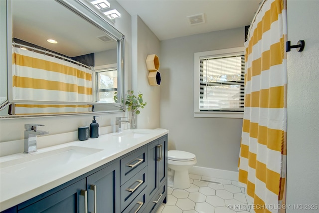 5132 S Atlanta Ave, Tulsa, OK 74105 - full bathroom with double vanity, tile patterned floors, toilet, baseboards, and a shower with curtain