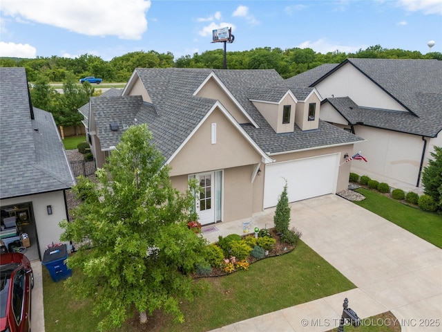 1228 W 85th Ct S, Tulsa, OK 74132 - view of front facade featuring stucco siding, a garage, a shingled roof, concrete driveway, and a front yard