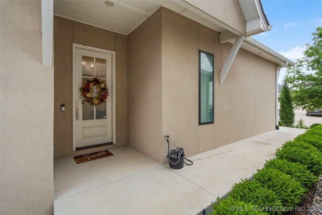 1228 W 85th Ct S, Tulsa, OK 74132 - entrance to property featuring stucco siding