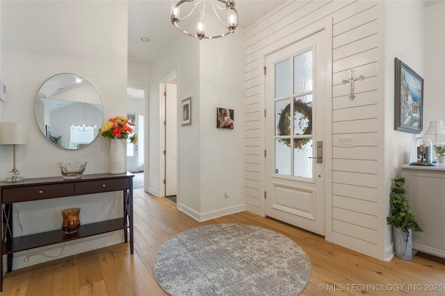 1228 W 85th Ct S, Tulsa, OK 74132 - entryway with a chandelier, light wood-type flooring, and healthy amount of natural light