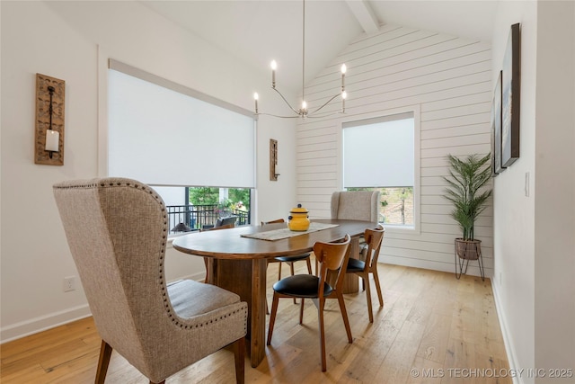 1228 W 85th Ct S, Tulsa, OK 74132 - dining room featuring plenty of natural light, light wood-style floors, baseboards, and a chandelier