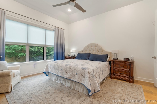 1228 W 85th Ct S, Tulsa, OK 74132 - bedroom with wood finished floors, baseboards, and a ceiling fan