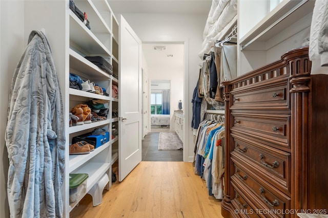 1228 W 85th Ct S, Tulsa, OK 74132 - walk in closet with hardwood / wood-style floors