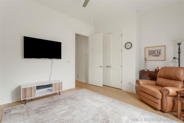 1228 W 85th Ct S, Tulsa, OK 74132 - living room with light wood-type flooring, ceiling fan, and baseboards