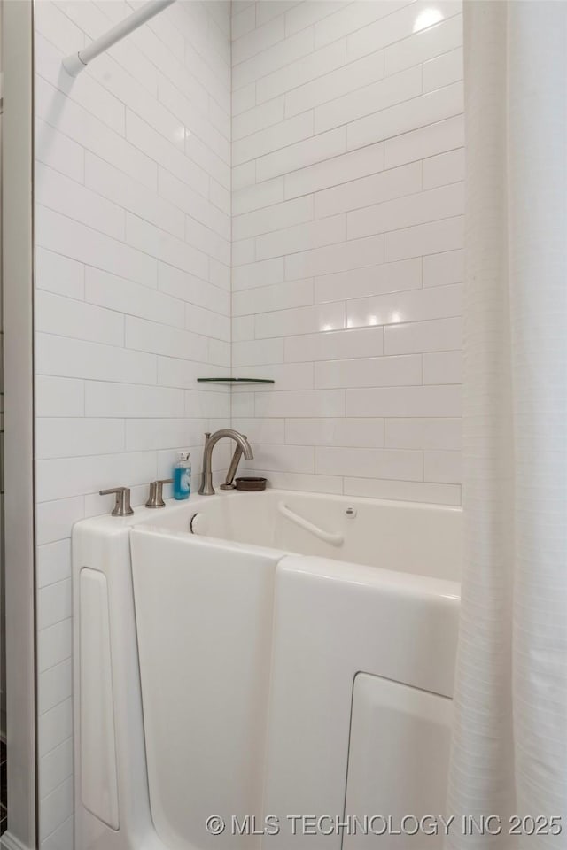 1228 W 85th Ct S, Tulsa, OK 74132 - bathroom with tile walls and a shower with curtain