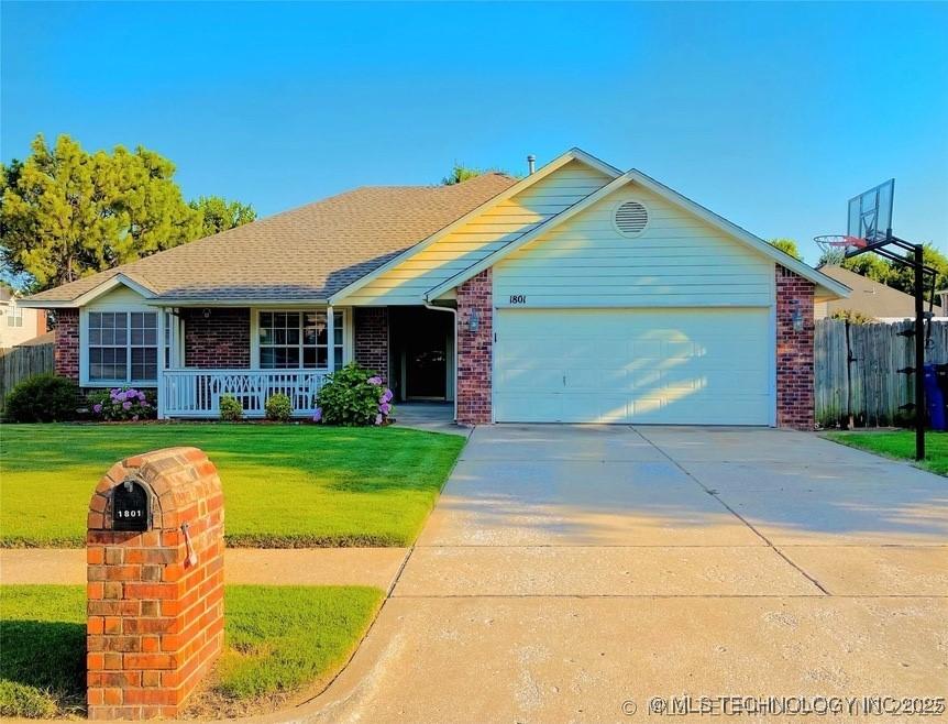 1801 W Jefferson St, Broken Arrow, OK 74011 - ranch-style home with an attached garage, brick siding, driveway, covered porch, and a shingled roof