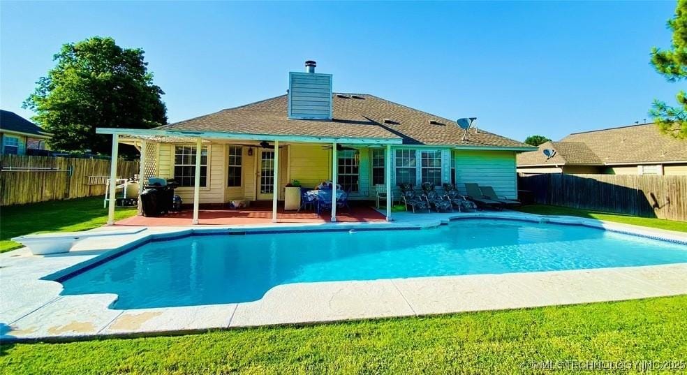 1801 W Jefferson St, Broken Arrow, OK 74011 - view of swimming pool with a fenced backyard, a patio, and a diving board