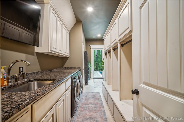 6317 E 110th St, Tulsa, OK 74137 - kitchen featuring independent washer and dryer, a sink, recessed lighting, and dark stone countertops
