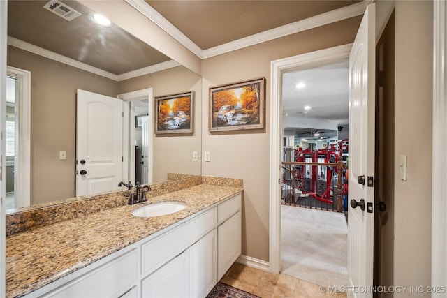 6317 E 110th St, Tulsa, OK 74137 - bathroom with vanity, crown molding, baseboards, and recessed lighting