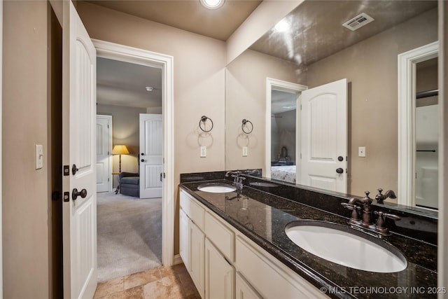 6317 E 110th St, Tulsa, OK 74137 - bathroom with double vanity and ensuite bath