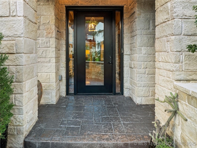 6317 E 110th St, Tulsa, OK 74137 - doorway to property featuring stone siding
