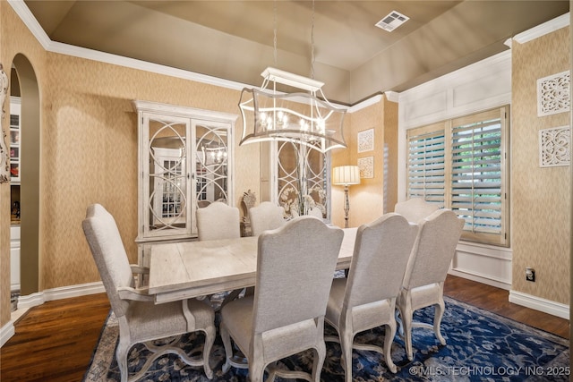 6317 E 110th St, Tulsa, OK 74137 - dining area featuring wallpapered walls, wood finished floors, arched walkways, a chandelier, and baseboards