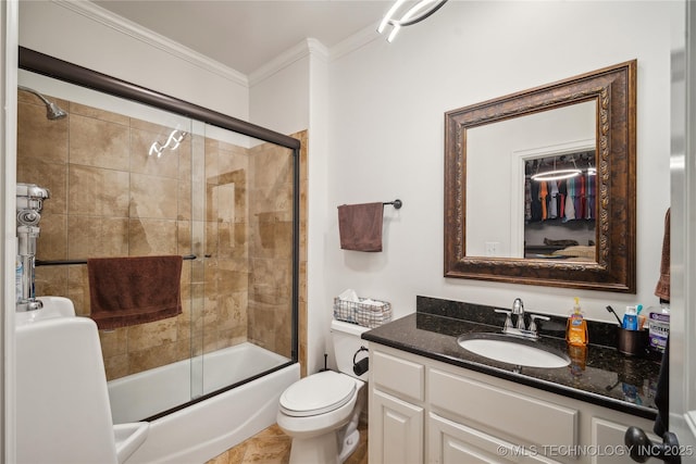 6317 E 110th St, Tulsa, OK 74137 - full bathroom featuring crown molding, vanity, shower / bath combination with glass door, and toilet