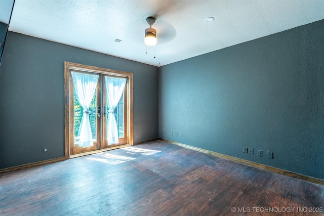3017 E 88th St, Tulsa, OK 74137 - empty room with wood finished floors, ceiling fan, baseboards, a textured wall, and a textured ceiling