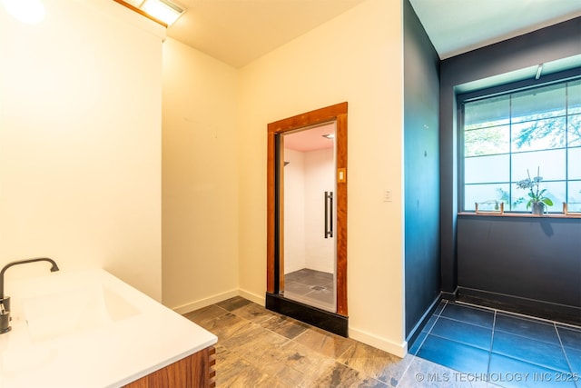 3017 E 88th St, Tulsa, OK 74137 - bathroom featuring vanity, a stall shower, and baseboards