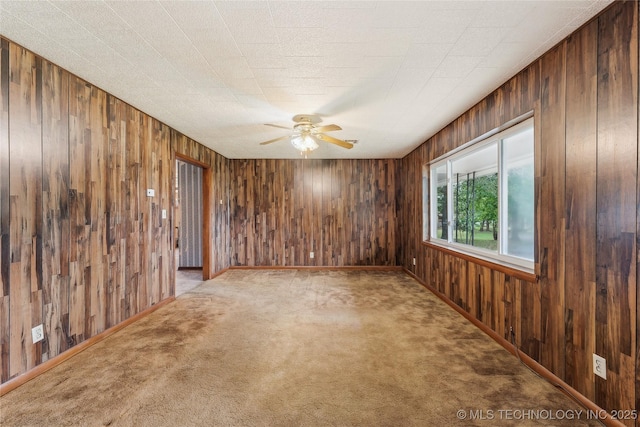 405 Dom Giaudrone, Mcalester, OK 74501 - unfurnished room with carpet flooring, ceiling fan, and wood walls