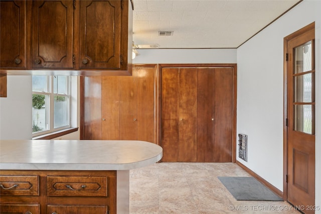 405 Dom Giaudrone, Mcalester, OK 74501 - kitchen with light countertops and brown cabinets