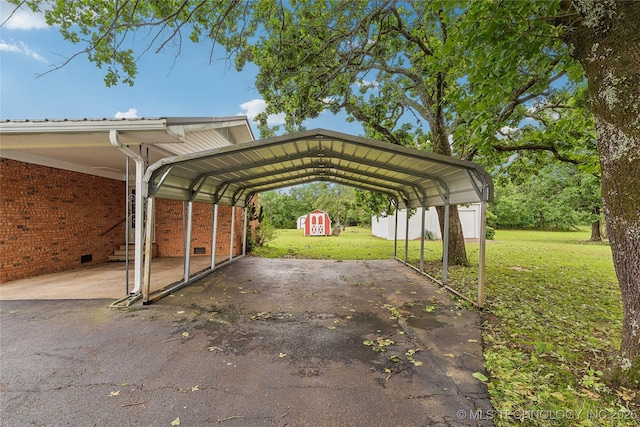 405 Dom Giaudrone, Mcalester, OK 74501 - view of vehicle parking with a storage unit, driveway, and a carport