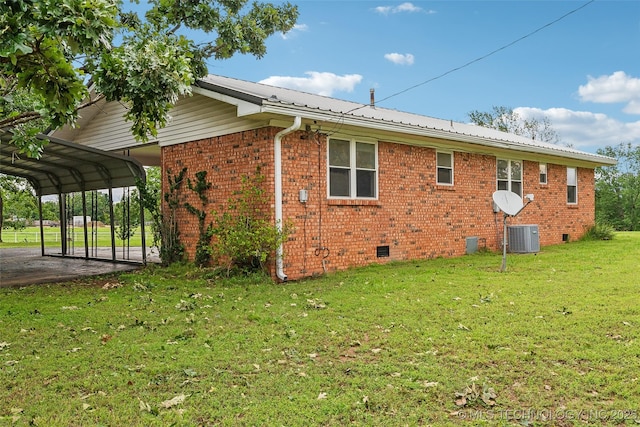 405 Dom Giaudrone, Mcalester, OK 74501 - view of side of home featuring crawl space, a lawn, metal roof, a detached carport, and central AC unit
