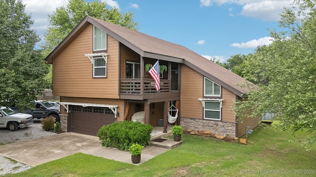 719 W Teel Rd, Sapulpa, OK 74066 - view of front of house with stone siding, a balcony, driveway, a front yard, and a garage