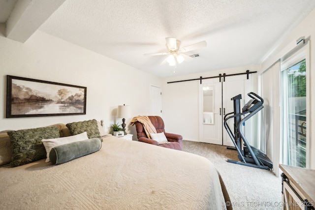 719 W Teel Rd, Sapulpa, OK 74066 - carpeted bedroom featuring a barn door, a textured ceiling, access to outside, and ceiling fan