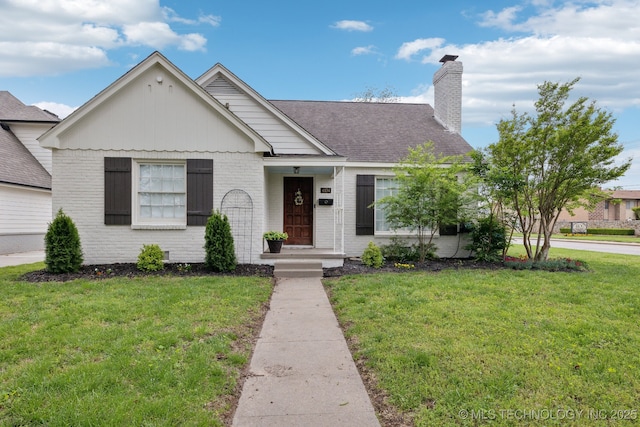 4104 S Owasso Ave, Tulsa, OK 74105 - view of front of home featuring brick siding, a front lawn, a chimney, and roof with shingles