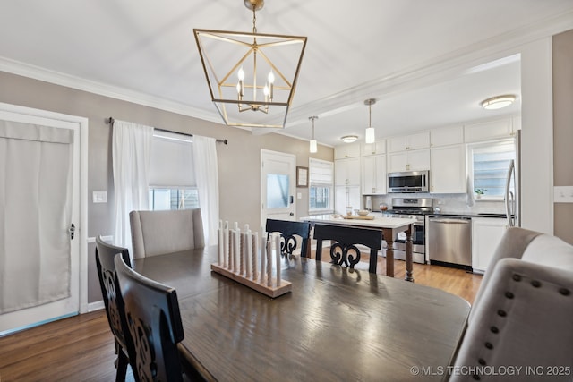 4104 S Owasso Ave, Tulsa, OK 74105 - dining space with a chandelier, crown molding, and light wood-style floors