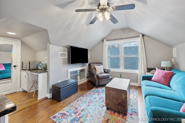 4104 S Owasso Ave, Tulsa, OK 74105 - living room featuring wood finished floors, vaulted ceiling, a ceiling fan, and baseboards