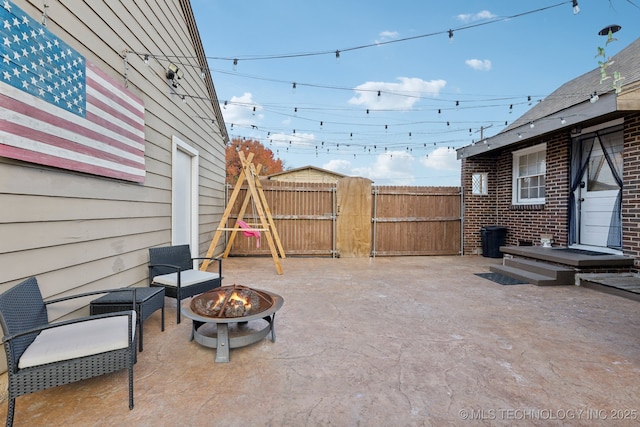 4104 S Owasso Ave, Tulsa, OK 74105 - view of patio / terrace with an outdoor fire pit and a gate