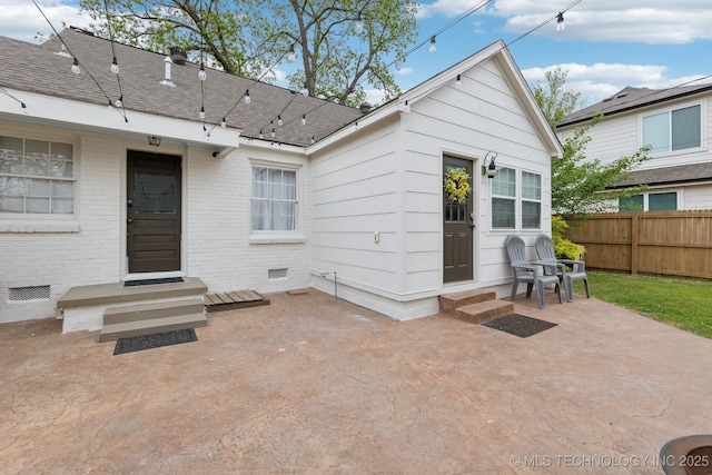 4104 S Owasso Ave, Tulsa, OK 74105 - rear view of house with entry steps, a patio, crawl space, brick siding, and a shingled roof