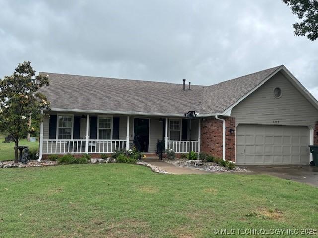 805 E 10th St, Claremore, OK 74017 - ranch-style home featuring a porch, a garage, a front lawn, roof with shingles, and driveway