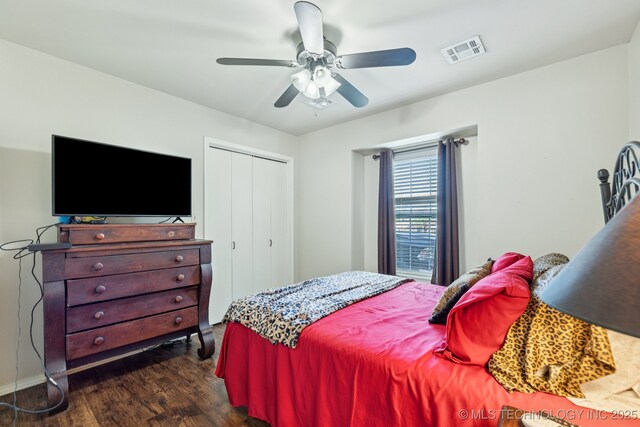 805 E 10th St, Claremore, OK 74017 - bedroom with dark wood-type flooring, a closet, and ceiling fan