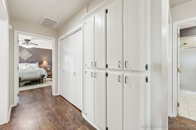 805 E 10th St, Claremore, OK 74017 - corridor featuring dark wood-style flooring and baseboards
