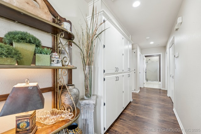 805 E 10th St, Claremore, OK 74017 - hallway featuring dark wood-style flooring, baseboards, and recessed lighting