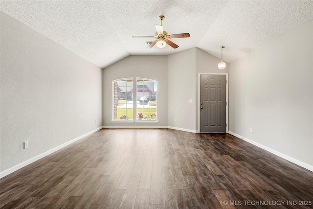 1309 N Willow Ave, Broken Arrow, OK 74012 - unfurnished living room featuring a ceiling fan, dark wood-type flooring, vaulted ceiling, a textured ceiling, and baseboards