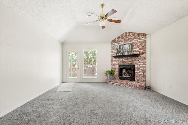 1309 N Willow Ave, Broken Arrow, OK 74012 - unfurnished living room featuring ceiling fan, carpet, a textured ceiling, a fireplace, and vaulted ceiling