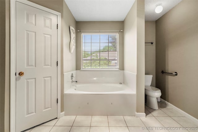 1309 N Willow Ave, Broken Arrow, OK 74012 - full bath with a garden tub, toilet, tile patterned flooring, and baseboards