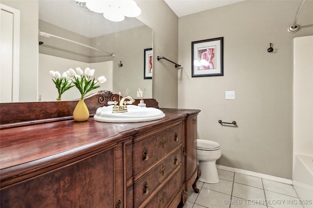 1309 N Willow Ave, Broken Arrow, OK 74012 - full bathroom featuring vanity, toilet, tile patterned floors, baseboards, and  shower combination