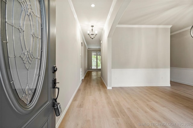 13041 E 67th St, Broken Arrow, OK 74012 - entrance foyer with a chandelier, light wood-style floors, crown molding, and baseboards