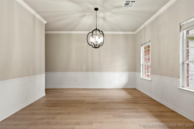 13041 E 67th St, Broken Arrow, OK 74012 - unfurnished room with a chandelier, plenty of natural light, wood finished floors, and crown molding