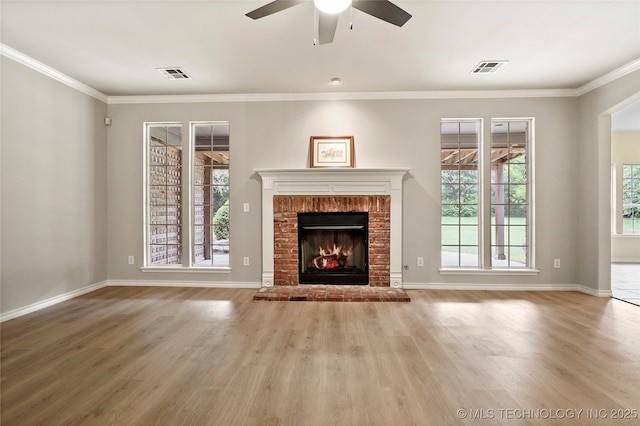 13041 E 67th St, Broken Arrow, OK 74012 - unfurnished living room featuring wood finished floors, a ceiling fan, plenty of natural light, and ornamental molding