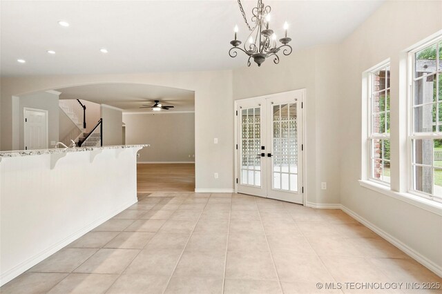 13041 E 67th St, Broken Arrow, OK 74012 - unfurnished dining area with french doors, light tile patterned floors, ceiling fan, stairway, and baseboards