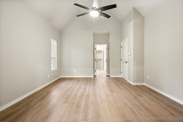 13041 E 67th St, Broken Arrow, OK 74012 - unfurnished room with high vaulted ceiling, light wood finished floors, a ceiling fan, and baseboards