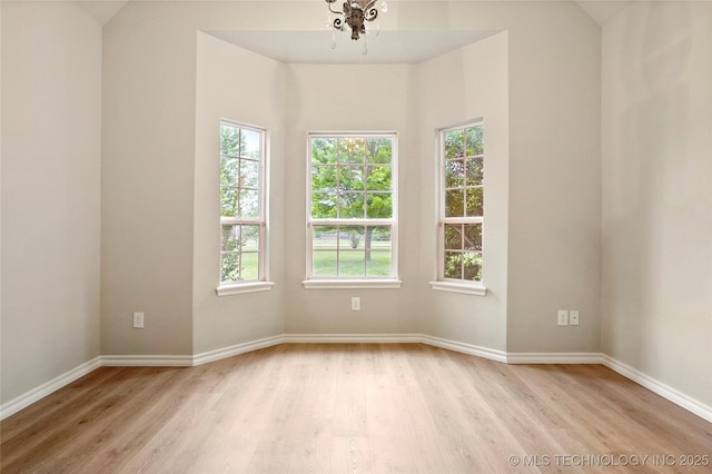 13041 E 67th St, Broken Arrow, OK 74012 - spare room featuring light wood-style flooring, baseboards, and lofted ceiling