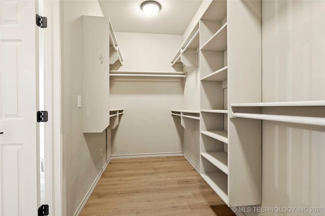 13041 E 67th St, Broken Arrow, OK 74012 - walk in closet with light wood-style flooring