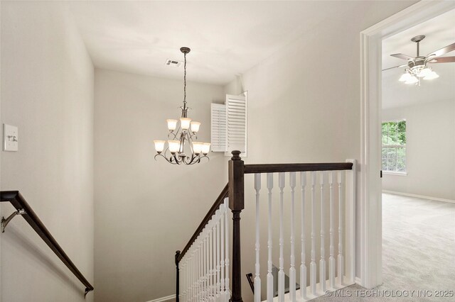 13041 E 67th St, Broken Arrow, OK 74012 - staircase with carpet, a chandelier, baseboards, and a ceiling fan