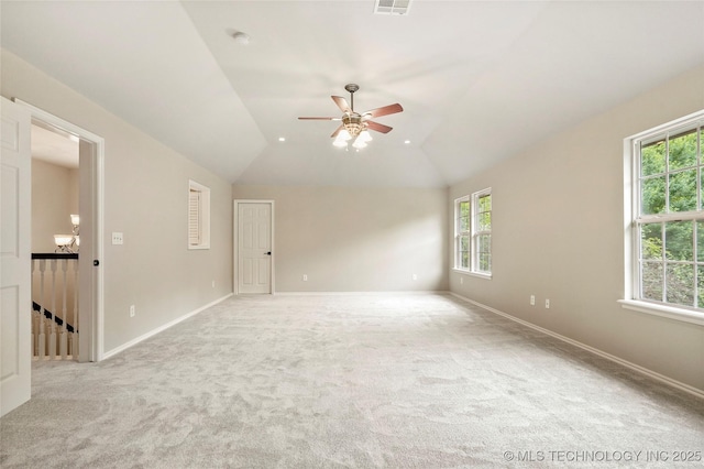 13041 E 67th St, Broken Arrow, OK 74012 - unfurnished room featuring healthy amount of natural light, ceiling fan, light colored carpet, and lofted ceiling